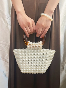 Handmade pearl beaded handbag with amber resin ring handles for elegant party wear