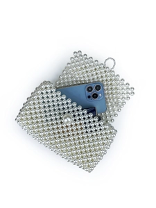 Handmade white faux pearl woven crossbody bag with flip cover and inner compartment
