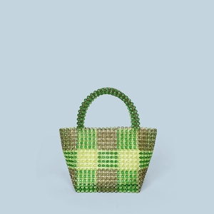 Detail of green checkered beaded tote bag with handmade transparent acrylic beads