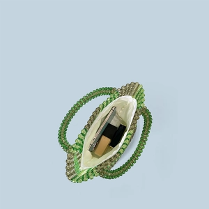 Top view of handmade beaded bag interior showing storage space for phone and makeup