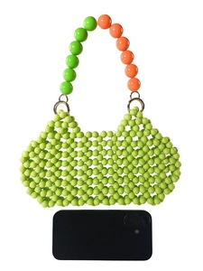 Handmade light green beaded handbag with orange handle and smartphone for size scale