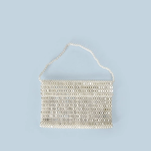 Close-up of silver metal sequin woven bag with luxury chainmail texture and flap closure