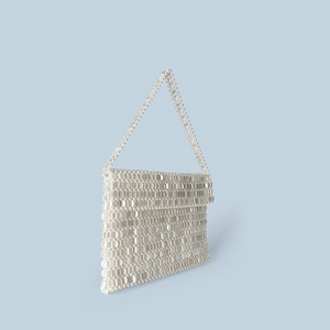 Detailed view of handmade woven pearl bead texture on a white rectangle flap handbag