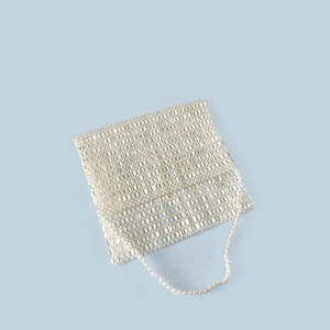 Detailed view of silver metal disc mesh construction on a large woven flap shoulder bag
