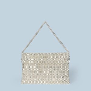 Detailed view of silver beaded handbag featuring glossy woven texture and sturdy top handle
