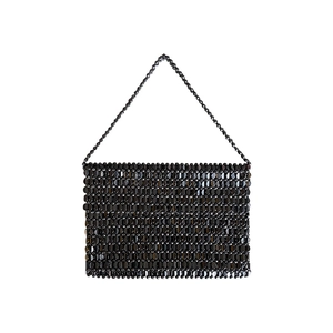 Macro shot of hand-woven black metallic sequins on this vintage chic tote bag