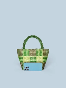 Handmade beaded tote bag with green and yellow plaid pattern shown with a smartphone