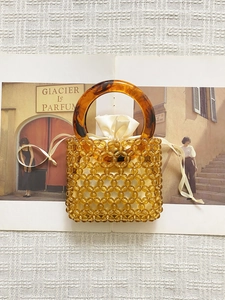 Handmade amber beaded bucket bag with tortoiseshell resin handles and satin liner