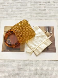 Handmade amber beaded bucket bag with large resin handle and satin drawstring pouch