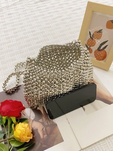 Silver handmade beaded crossbody bag with vintage chain and chic elegant design