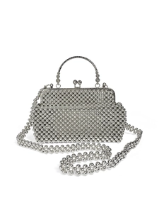 Macro detail of silver handmade beaded handbag with vintage clasp and metallic finish