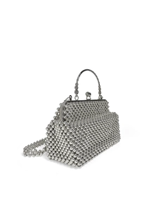 Detail of silver beaded evening bag with metallic finish and engraved metal handle