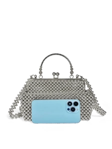 Detail of silver beaded evening bag with metal handle and matching chain strap