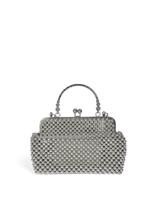 Detail of silver beaded handbag featuring metal handle with intricate engraving
