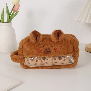 Detail of Capybara plush pencil case with transparent window and cute charm inserts