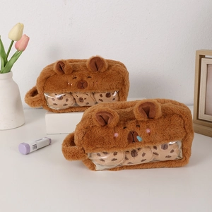 Detail of plush Capybara pencil case featuring a transparent window with fluffy balls
