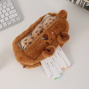 Close-up of plush capybara pencil case with transparent window and cookie accessories