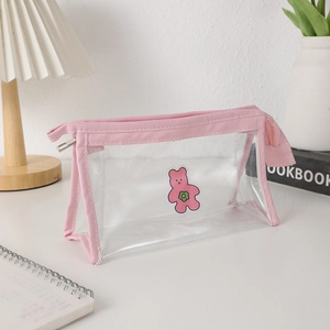 Detail of transparent PVC pencil case with cute pink bear print and pink fabric trim
