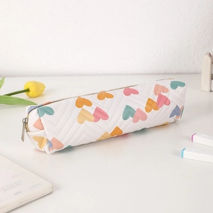 Close-up of heart pattern pencil case with V-shaped chevron quilting and metal zipper
