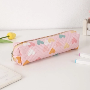 Detail of pink PU pencil case featuring quilted V-lines and colorful heart patterns