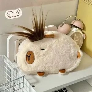 Detail view of the soft white plush Capybara pencil case with creative long brown hair accent