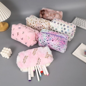 Close-up of fluffy plush stationery pouches with zip closure in various patterns