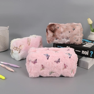 Detailed view of plush makeup bags with cute butterfly and unicorn patterns and zippers