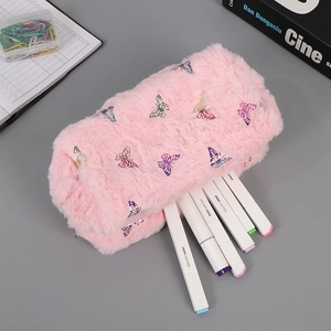 Close-up of pink plush pencil case with iridescent butterfly patches and silver zipper