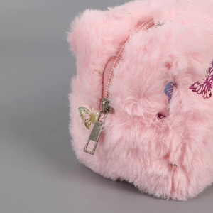 Close-up of pink plush stationery pouch with colorful butterfly patterns and zipper detail