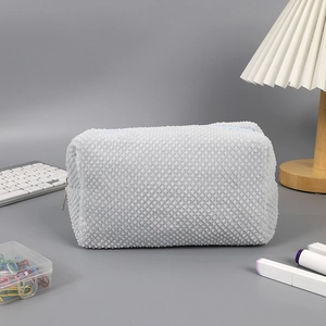 Detail of soft cream waffle texture on large capacity plush pencil case with zipper