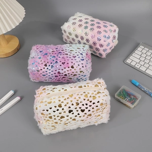 Detailed view of plush stationery pouches with rainbow snowflakes and heart patterns