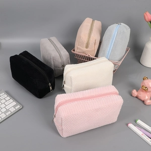 Plush cream-colored large capacity pencil cases in six assorted pastel colors