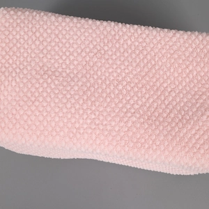 Macro shot of pink bubble texture fabric showing the soft plush pencil case material