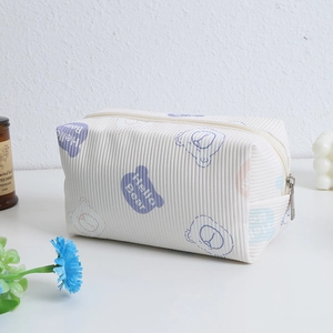 Detailed texture of corduroy gummy bear cosmetic bag with zipper and Hello Bear print