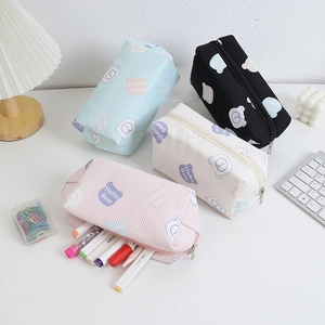 Corduroy gummy bear pouches in pink, blue, white, and black with Hello Bear print