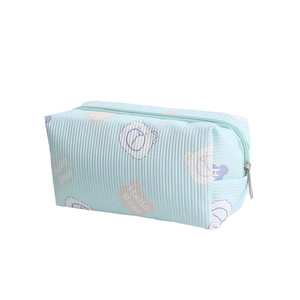 Cute light blue corduroy gummy bear makeup bag with top zipper and Hello Bear pattern