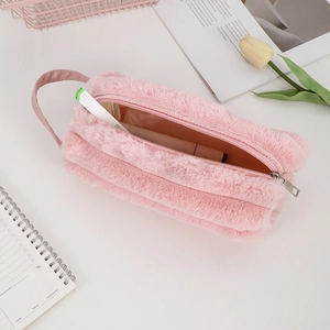Pink plush pencil case with zipper and PU handle shown with stationery for capacity