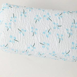 Detail of floral pencil case showing 3D seersucker texture and blue flower pattern