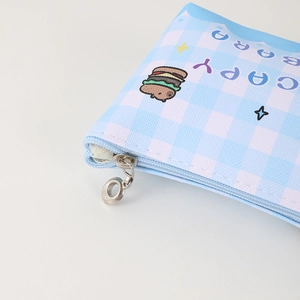 Detail of metal zipper and checkerboard fabric texture on Capybara pencil case