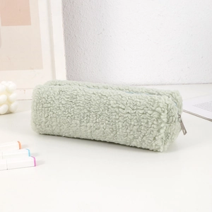 Detail of soft green sherpa pencil case showing fluffy texture and metal zipper