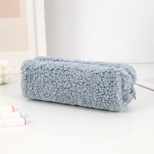 Detail of plush faux fur pencil case in misty blue with smooth metal zipper closure