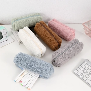 Close-up of thick plush pencil cases in six soft colors with fluffy lamb wool texture