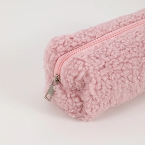 Close-up of pink faux plush texture and smooth zipper on a large capacity pencil case