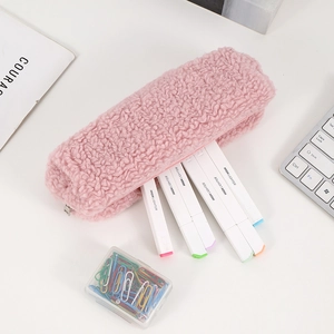 Detailed macro view of plush pink faux shearling pencil case with large storage capacity