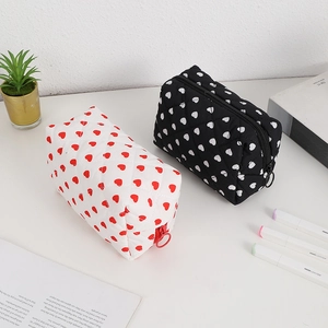 Quilted cotton heart pattern cosmetic bags in white and black with ring zippers