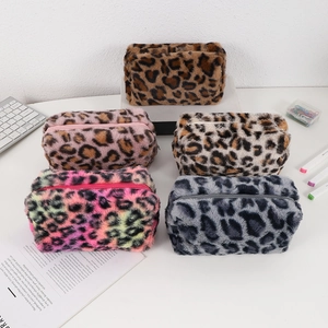 Five-piece leopard print faux fur cosmetic bags in assorted colors with zip closure