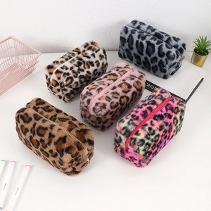 Faux rabbit fur leopard print makeup bags in various colors with soft plush texture
