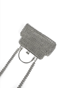 Detail of silver beaded evening clutch with metal ring handle and luxury pearl chain strap