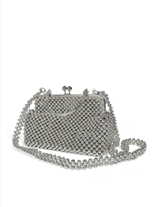 Detail of silver beaded evening bag with metallic finish and vintage frame clasp
