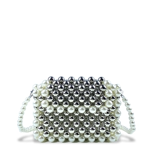 Detail shot of the woven bead texture featuring white pearls and silver metallic beads